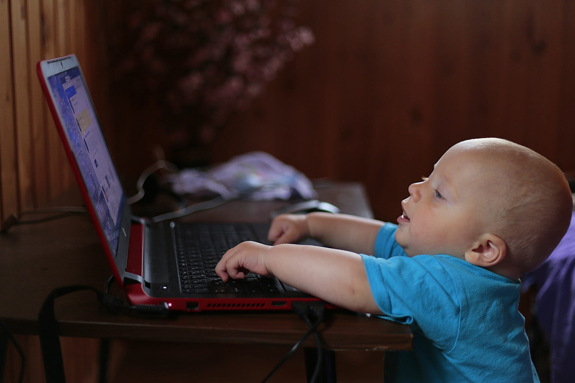 Tiny baby at a computer