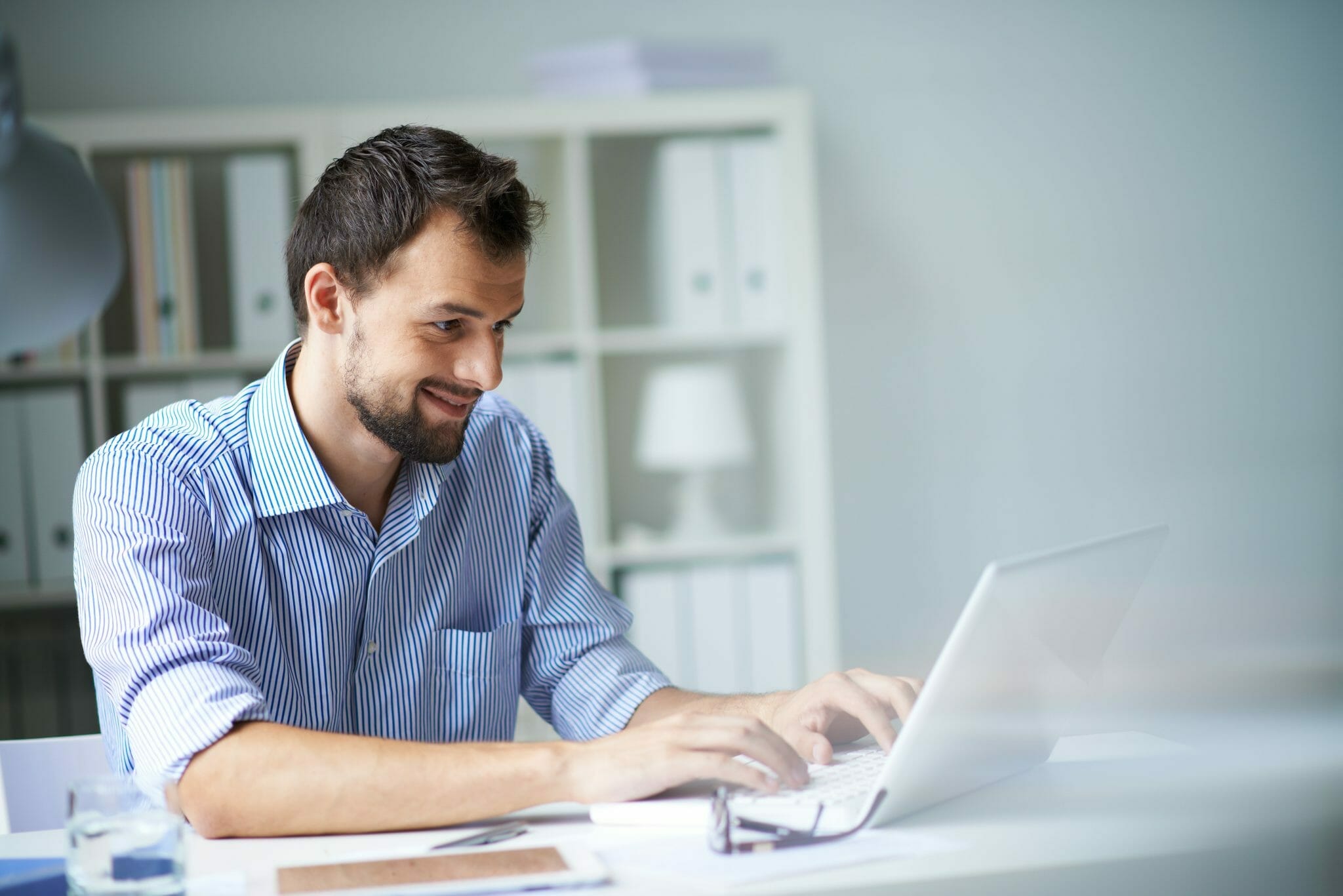 Man sitting at a laptop working