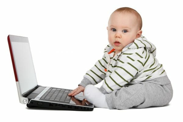 Baby learning at a laptop