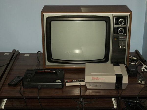 SEGA console next to NES
